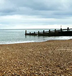 70 - Blue sky. Empty beach. Low tide.